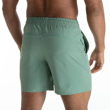 Man wearing black quick-dry polyester sports shorts suitable for running or gym workouts.