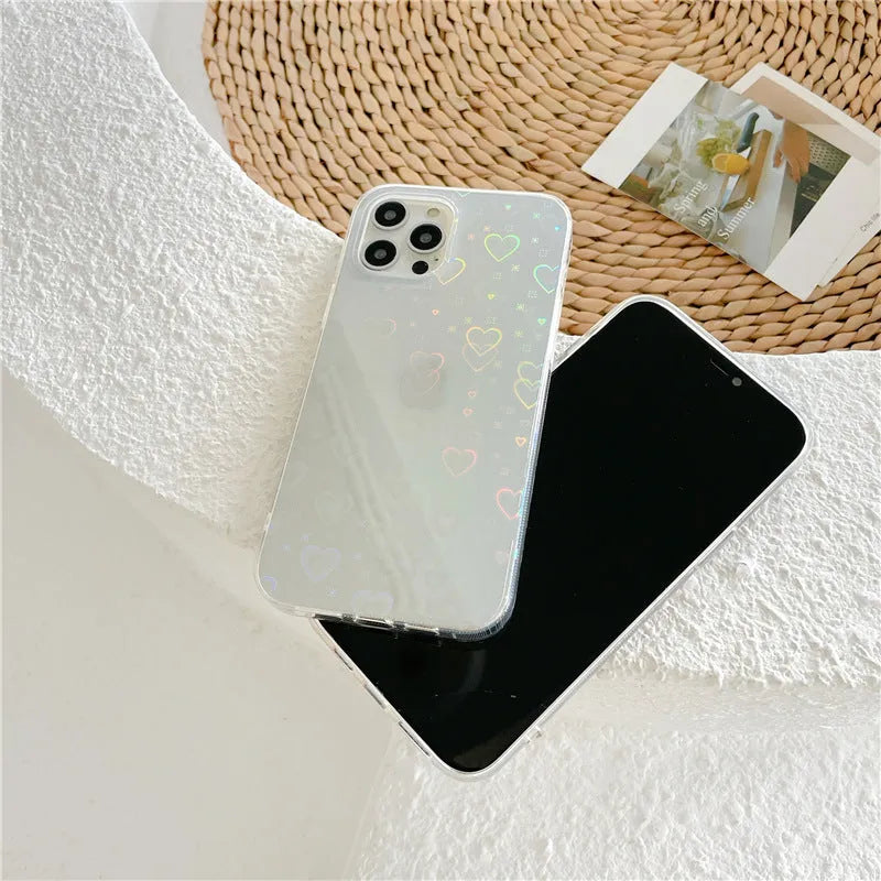 Laser colourful love silicone phone case with transparent colour and laser-etched motifs, shown on an iPhone.
