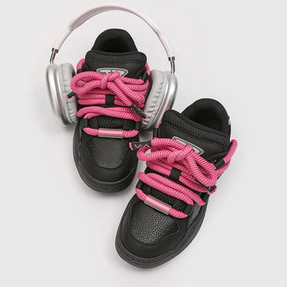 A pair of thick-soled casual lace-up shoes in a solid colour with a round toe and mesh lining.