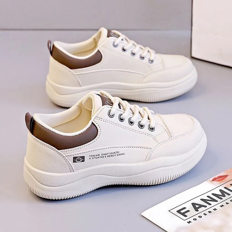 Women's white Korean-style lace-up pumps with a cross strap detail and a mid heel.