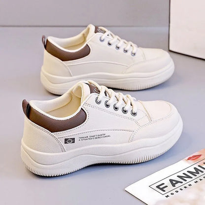 Women's white Korean-style lace-up pumps with a cross strap detail and a mid heel.