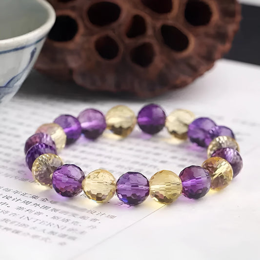 Handmade crystal bracelet with 128-cut gemstone beads and zodiac charm on wrist