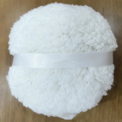 Oversized plush dry puff for makeup powder application in white colour, measuring 150mm by 75mm