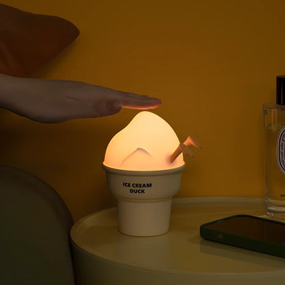 Abstract duck night lamp with ice cream colours measuring 103mm tall with USB charging port