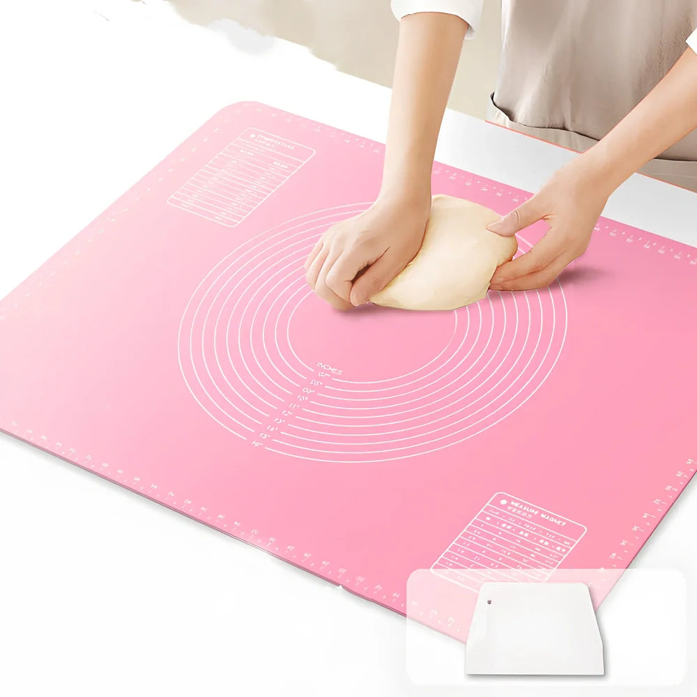 Green antibacterial silicone kneading mat with noodle cutter and rolling pin on kitchen counter