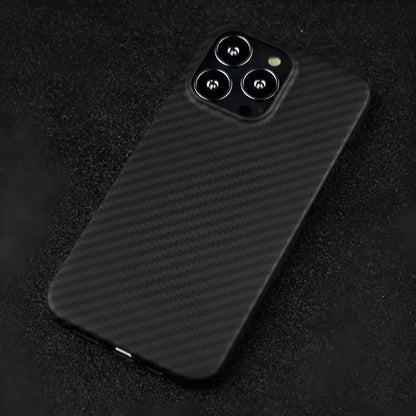 Matte black Kevlar fibre protective case for iPhone showing crater texture and exposed side buttons.