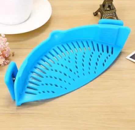 Silicone clip-on kitchen strainer with stainless steel frame attached to pot rim