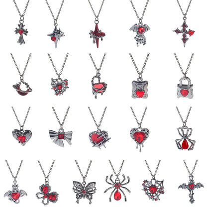 Gothic style zinc alloy necklace with bat pendant on a silver chain against dark background.