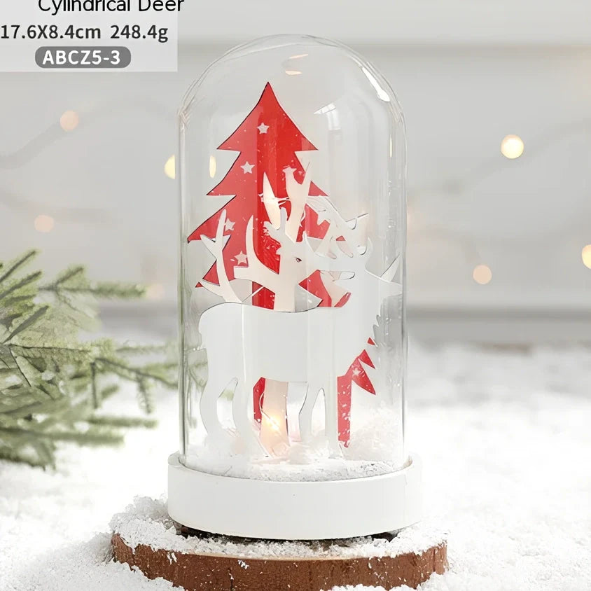 Small 15 cm glass reindeer night lamp in white snowman cabin style casting 100 lumen festive glow on table
