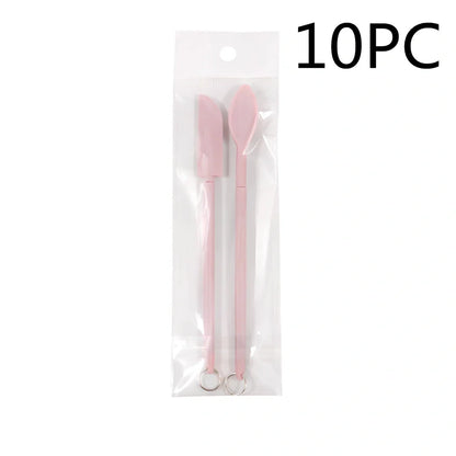 Retractable silicone cosmetic spatula extended to 15cm with scraper tool for product application