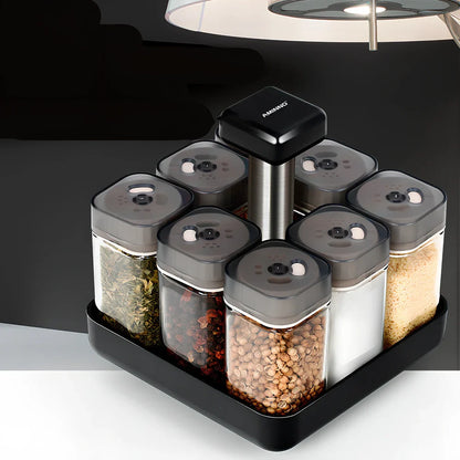 Six clear glass spice jars with natural bamboo lids in stackable configuration