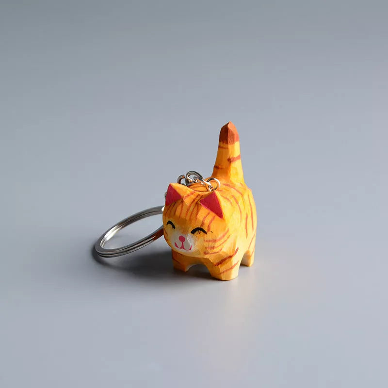 Handmade wooden cat trinkets in gray and orange, perfect for decor or gifts