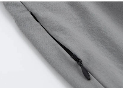 Women's loose sports cropped pants in grey with printed waistband for workouts and running activities