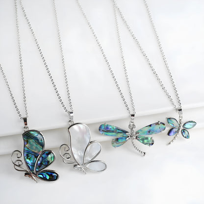 Abalone shell pendant necklace with copper electroplated animal zodiac design and butterfly or dragonfly detail