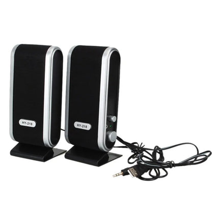 Black compact USB notebook mini speaker for laptop and computer audio enhancement.