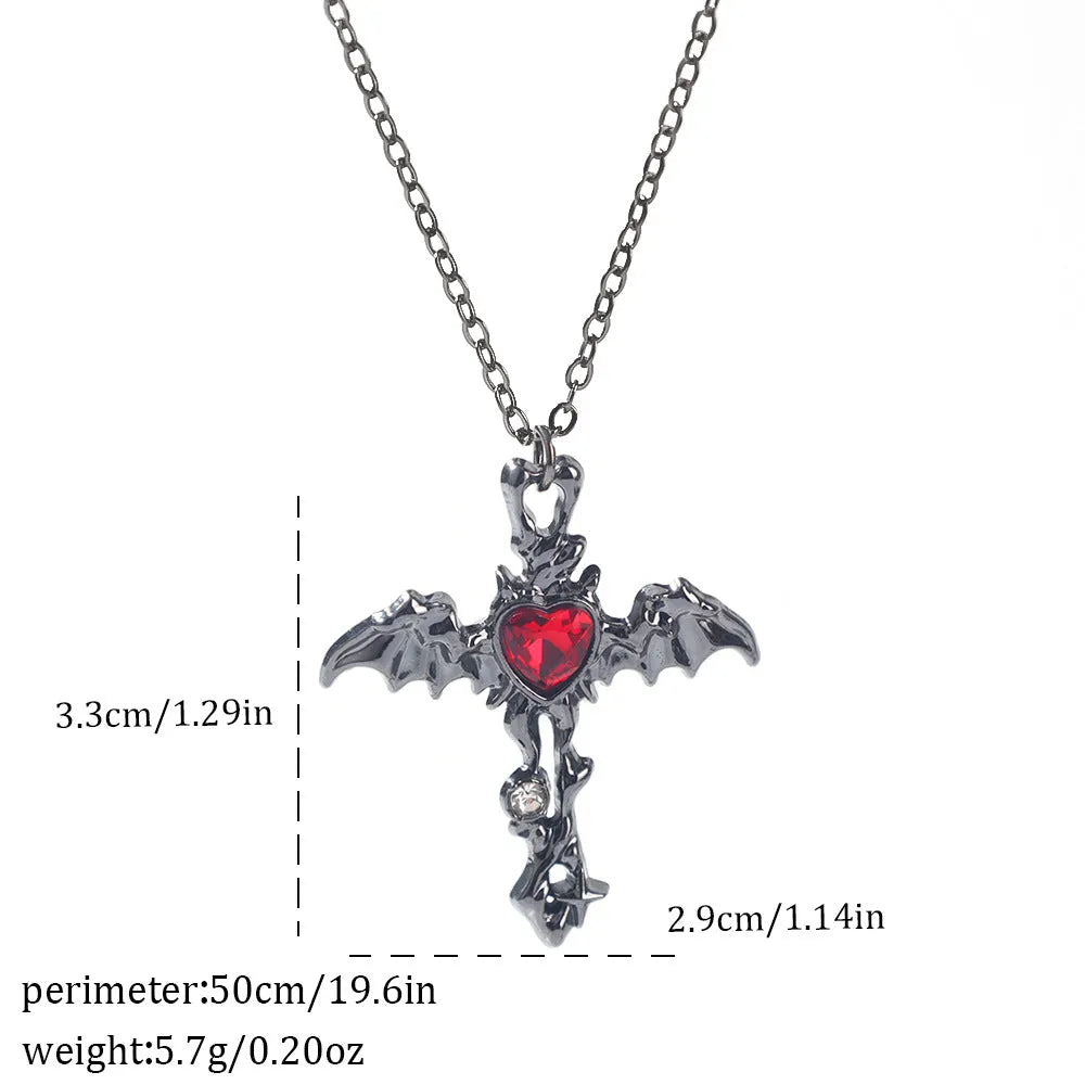 Gothic style zinc alloy necklace with bat pendant on a silver chain against dark background.