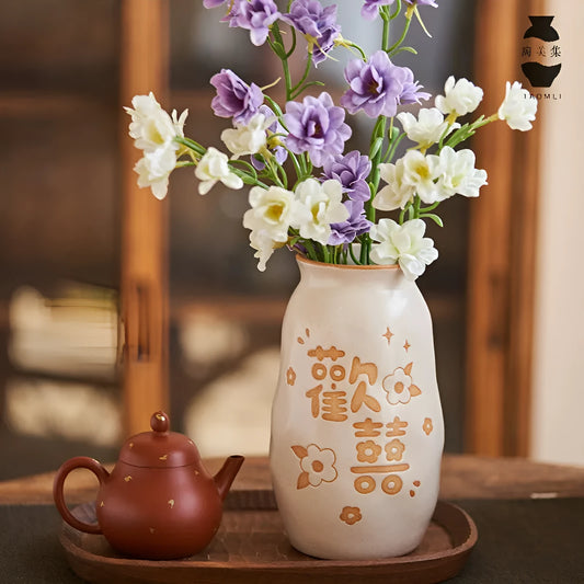 Hand-painted Chinese ceramic vase with carved detail on a desk, shown in Double Happiness colour design.