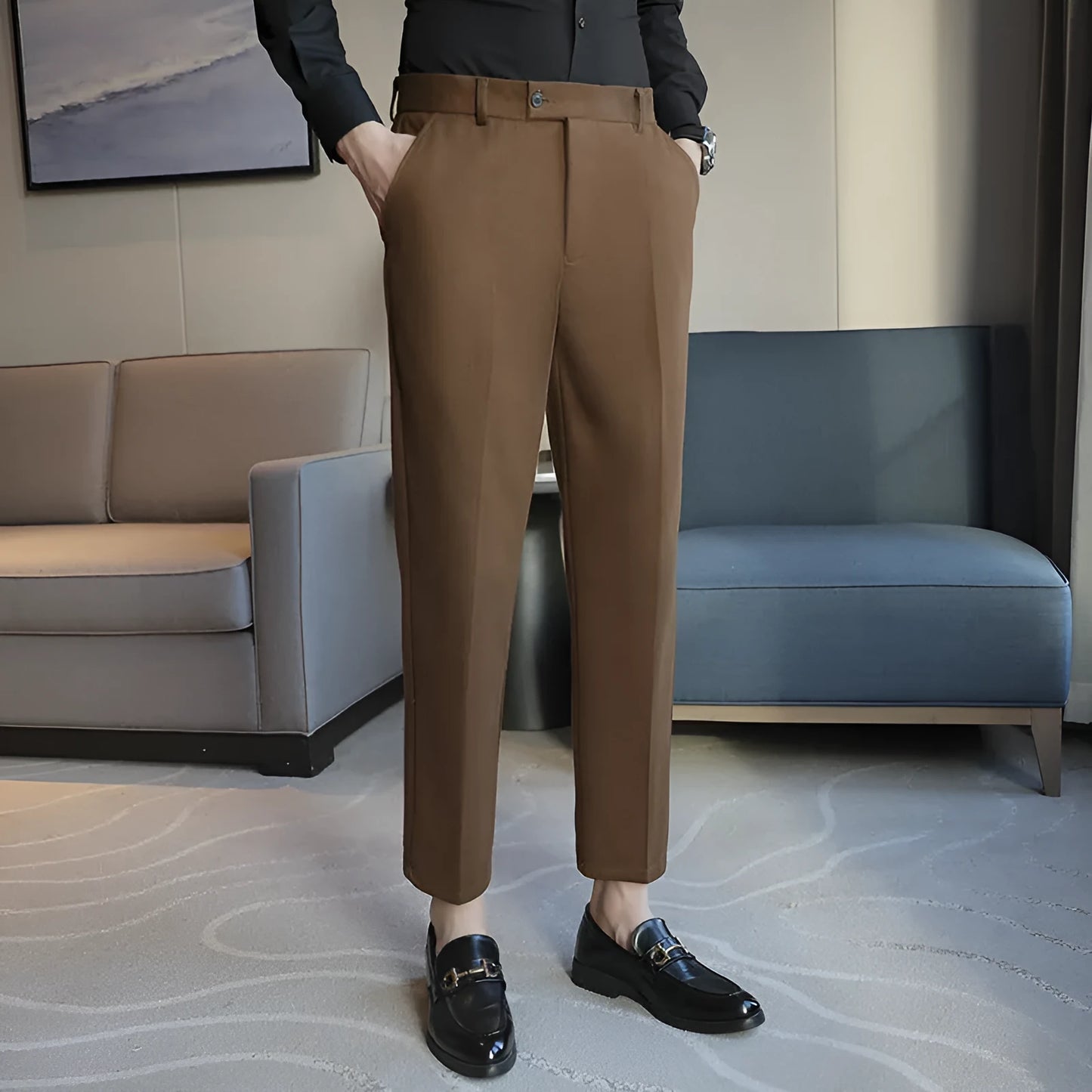 Straight-leg brown corduroy trousers with elastic waistband and slim fit design