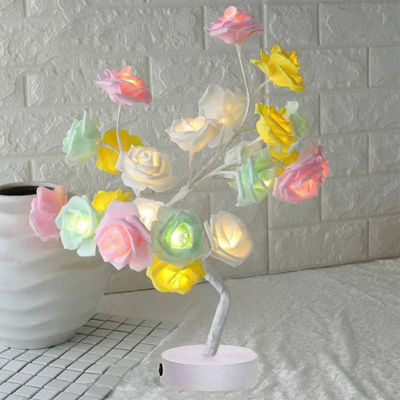 White and red rose flower LED lamp on a bonsai tree stand with warm white lights.