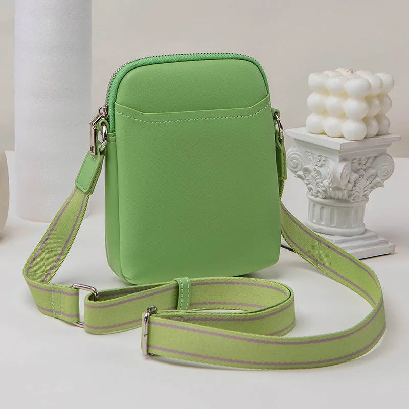Solid colour mobile phone bag with adjustable strap showing 14.5x5.5x19cm dimensions and PU material construction