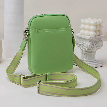 Solid colour mobile phone bag with adjustable strap showing 14.5x5.5x19cm dimensions and PU material construction