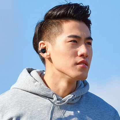 Black clip-on bone conduction wireless Bluetooth earphones with charging cable