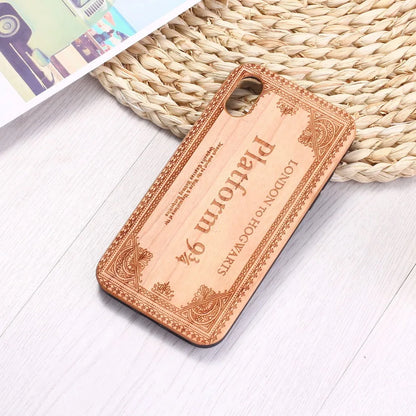 Wooden iPhone case with a laser-carved floral design and a black TPU bumper, shown fitted on an iPhone.