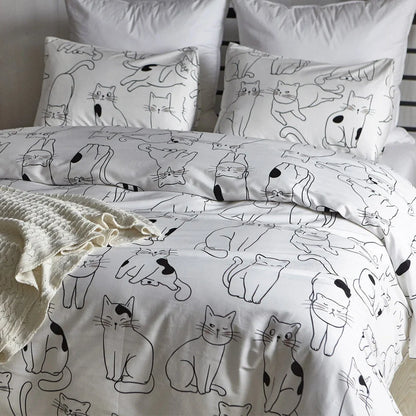 White cotton bedding set with active printed pattern, showing duvet cover, fitted sheet and pillowcases