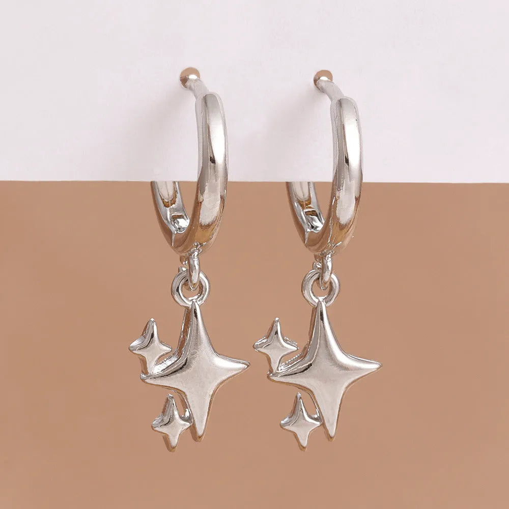 Small star-shaped copper earrings for women in gold or silver, supplied as one pair