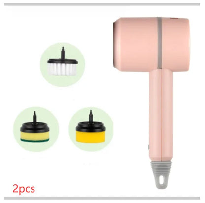 Green electric cleaning brush with scouring pad and brush heads on a kitchen worktop.