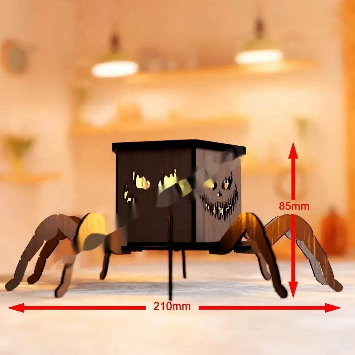 Wooden Halloween spider lantern candlestick with cut-out designs, shown next to a candle.