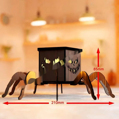 Wooden Halloween spider lantern candlestick with cut-out designs, shown next to a candle.