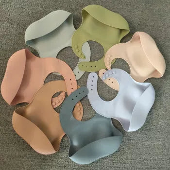 Soft waterproof silicone baby bib with food catcher in various colors