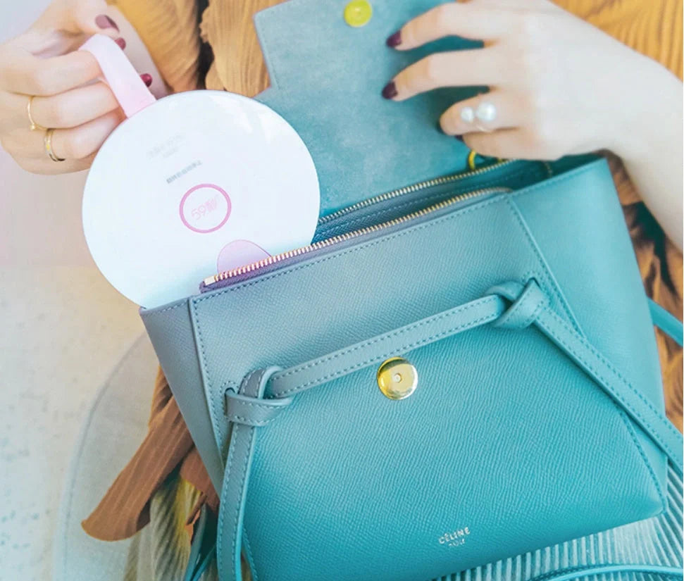 Compact USB-powered baby bottle sterilizer in blue and pink options