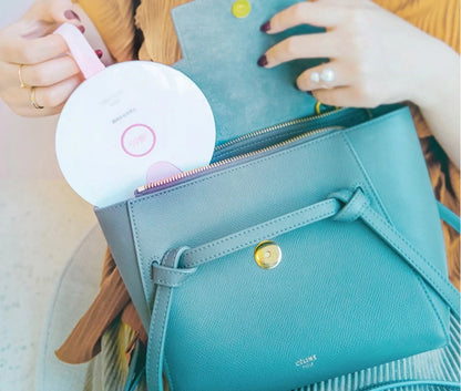 Compact USB-powered baby bottle sterilizer in blue and pink options