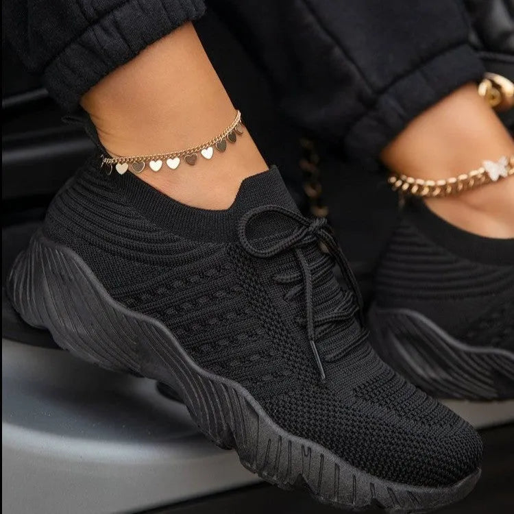 Women's solid colour sneakers with a thick sole, shown in multiple colour options.
