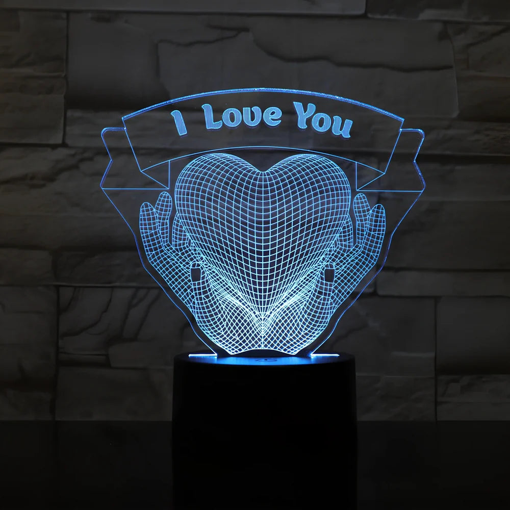 3D acrylic night light with hands holding heart design, showing seven colour options and remote control