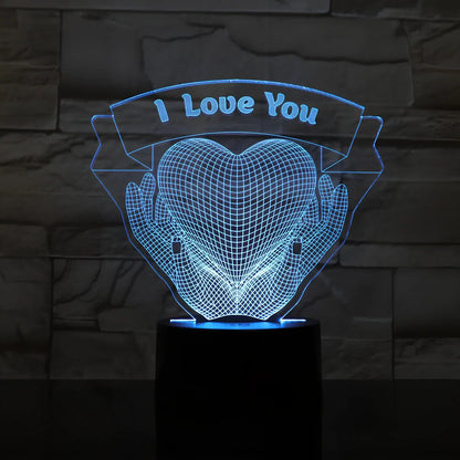3D acrylic night light with hands holding heart design, showing seven colour options and remote control