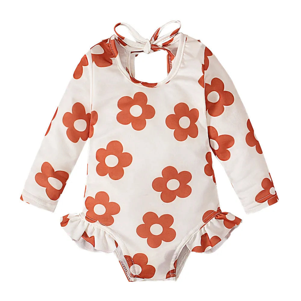 Girl's floral print swimsuit with crew neck and open back design in polyester fabric