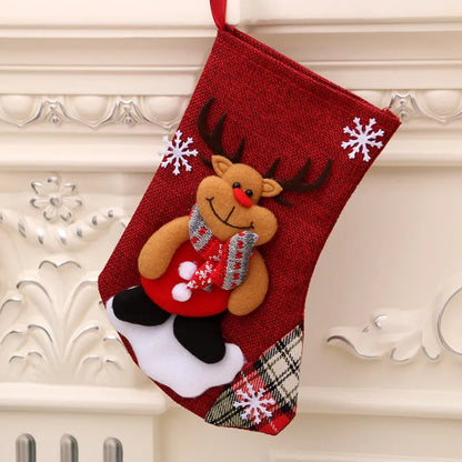 Multicolour Christmas hanging socks and gift bag with old man, snowman, deer, and bear designs