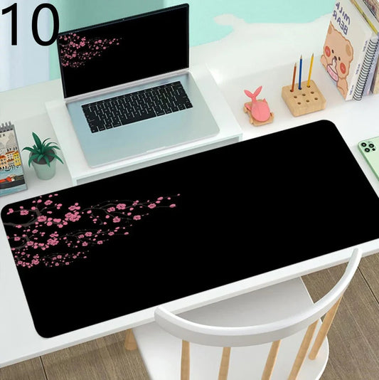 Large gaming mouse mat with printed design on rubber base, multiple size options from 300x600mm to 400x900mm