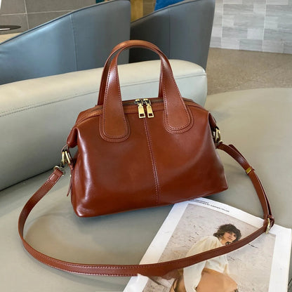 Soft pillow-shaped top grain leather handbag, 30cm x 13cm x 22cm, with double straps and inner patch pocket
