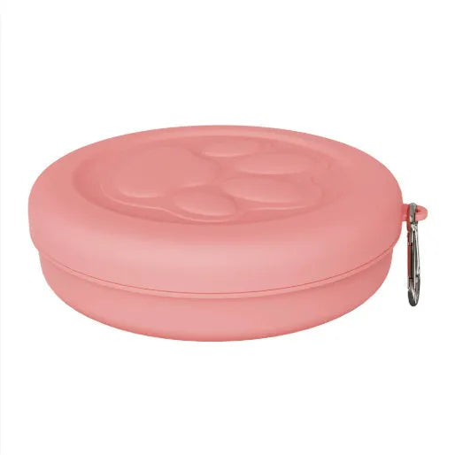 Collapsible silicone dog bowl with integrated snack compartment in light pink colour