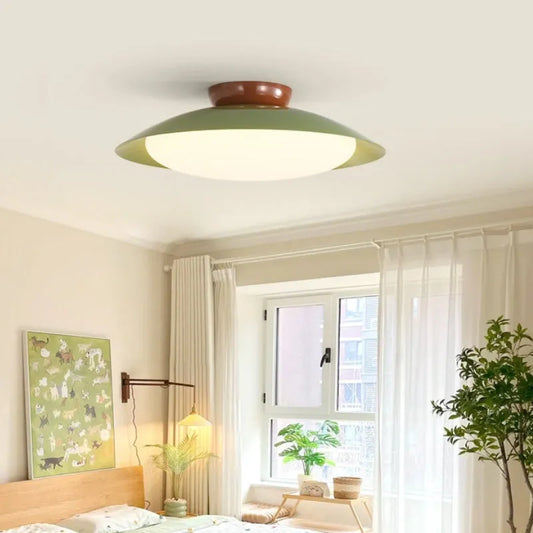 Modern flying saucer shaped ceiling lamp in cream style with minimalist design and clean geometric lines