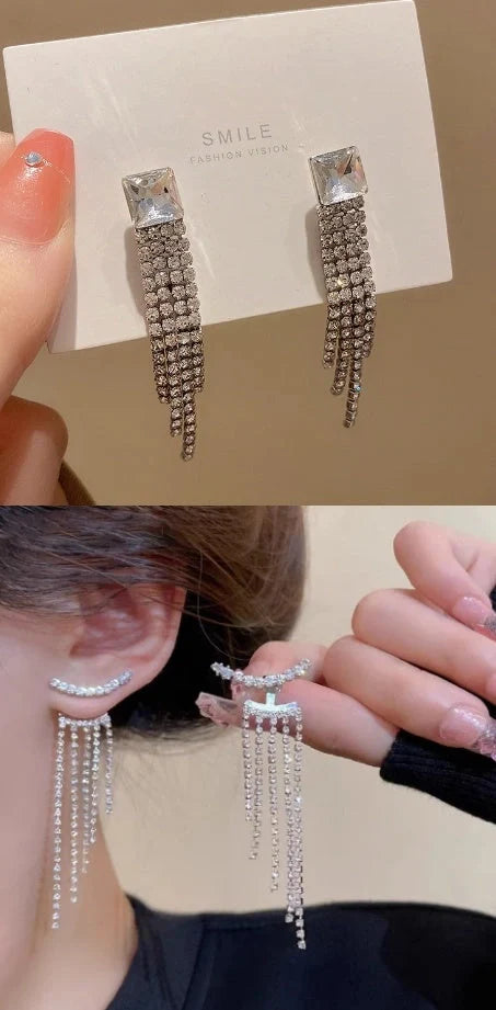 Sparkling zircon tassel earrings in sterling silver, featuring dazzling gems and flowing tassels for a bold, fashionable look.