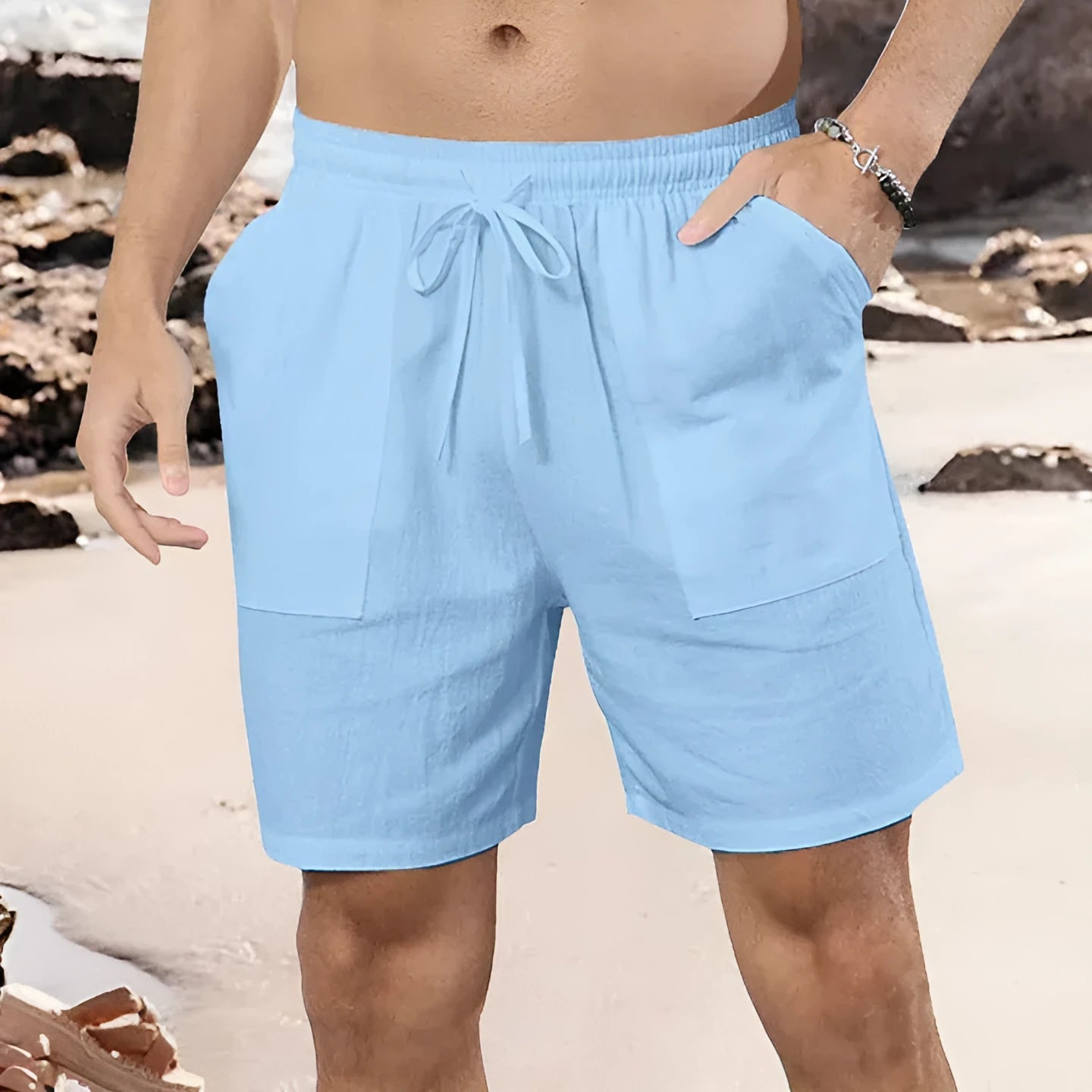Men's straight leg linen shorts in light blue on a plain background