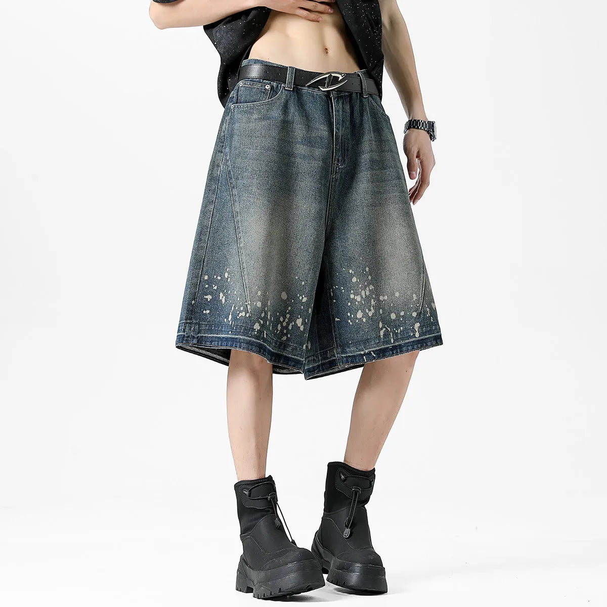 Retro blue denim shorts for men with ripped details and splash ink pattern on a straight cut.