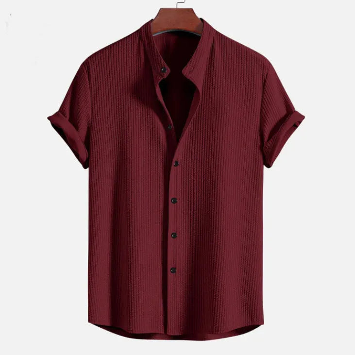 Men's loose short sleeve shirt in polyester, available in colours like wine red and navy blue, sizes S to 4XL
