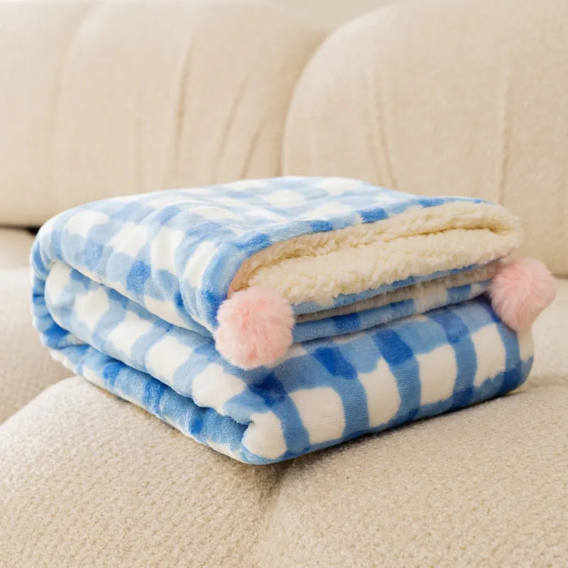 Blue coral fleece pet blanket shown in a Large size (70x50cm) on a wooden floor.