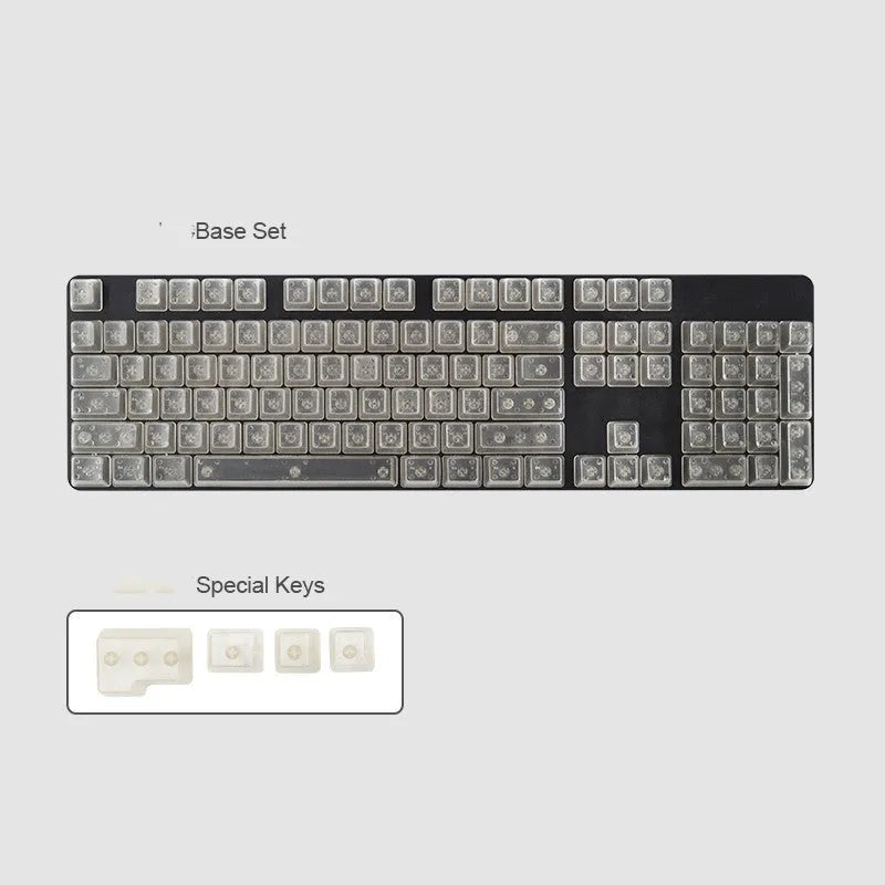 Set of 104 transparent blank PBT keycaps for mechanical keyboards in orange, white, blue, and black colours.